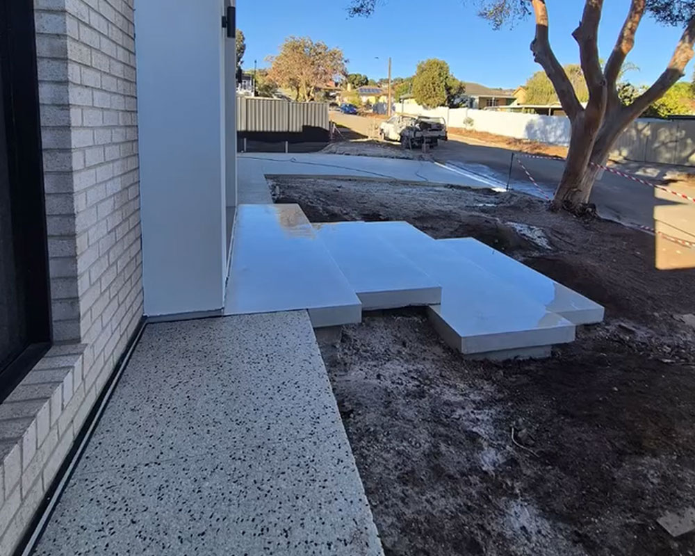 Floating concrete stairs by Concrete By Joe