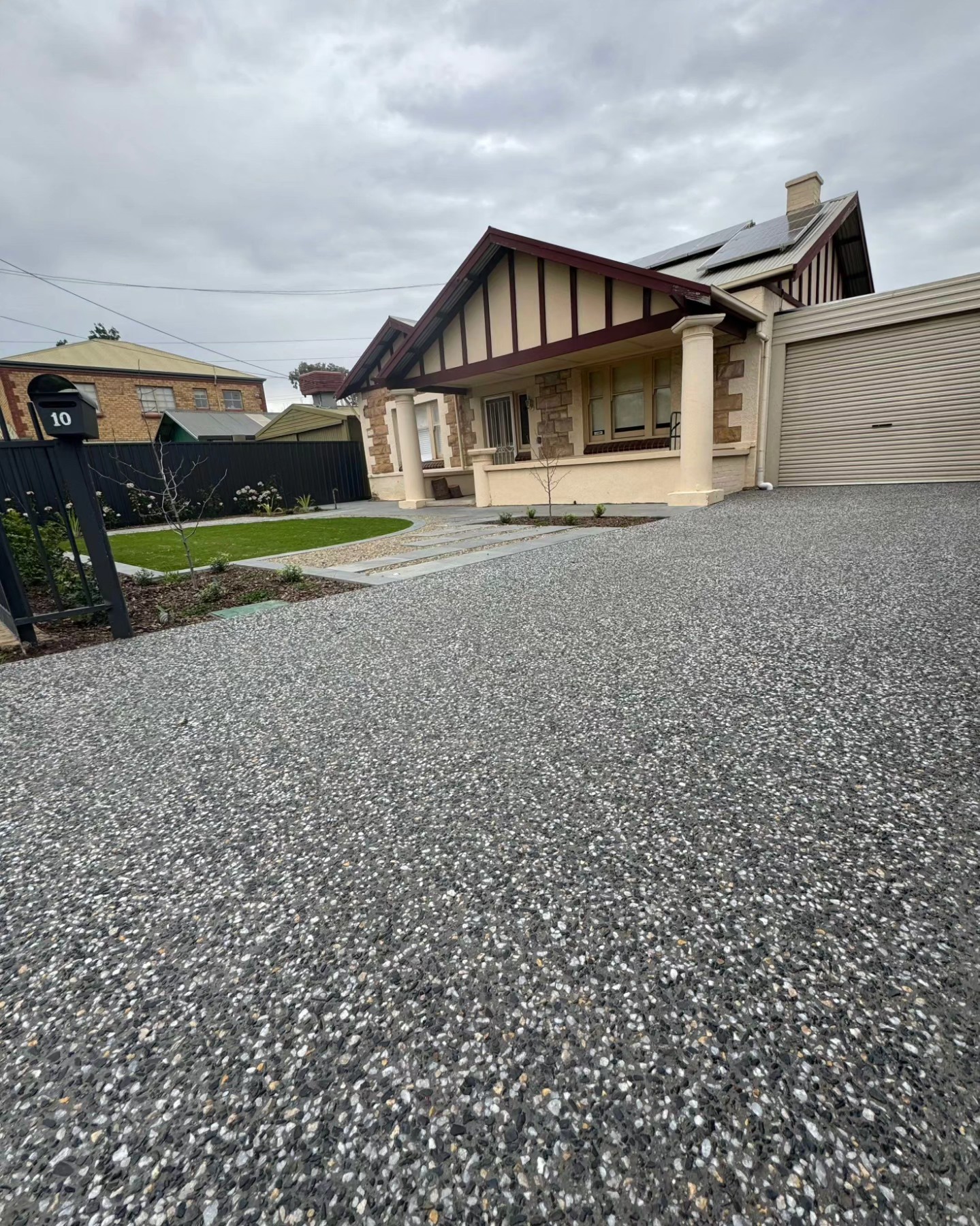 Modern exposed aggregate driveway installation